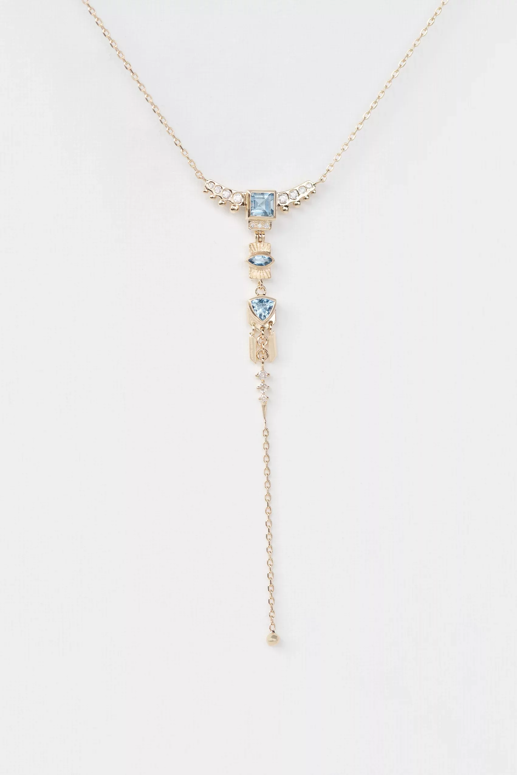 Yellow gold lariat necklace layered chains aquamarine diamond totem charms drop chain Celine Daoust