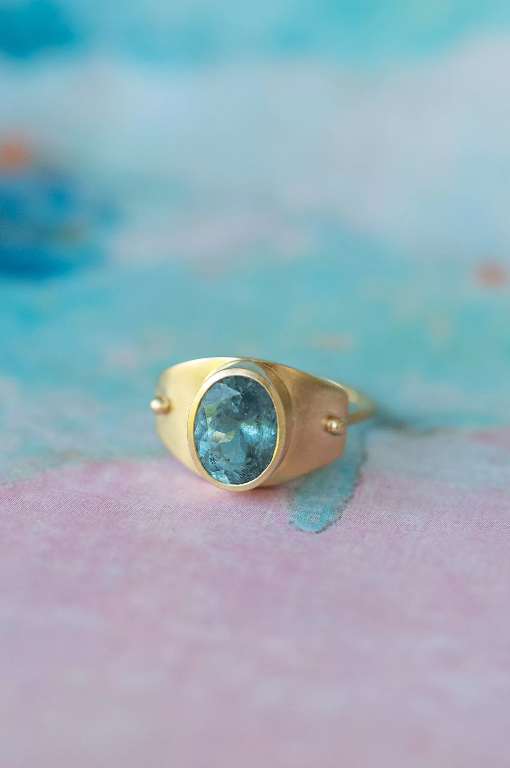 Gold signet ring large oval light blue tourmaline matte bezel Céline Daoust