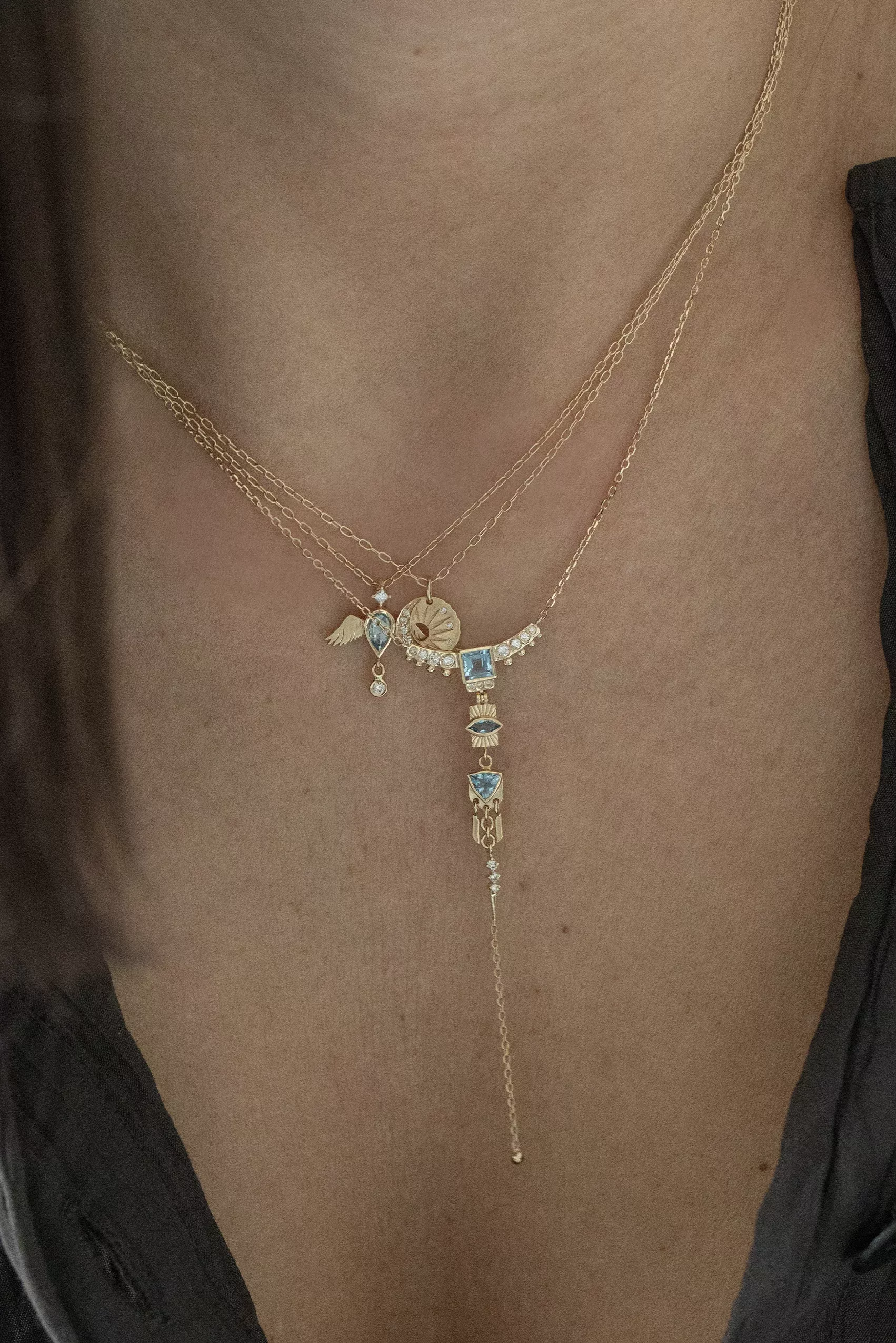 Yellow gold lariat necklace layered chains aquamarine diamond totem charms drop chain Celine Daoust