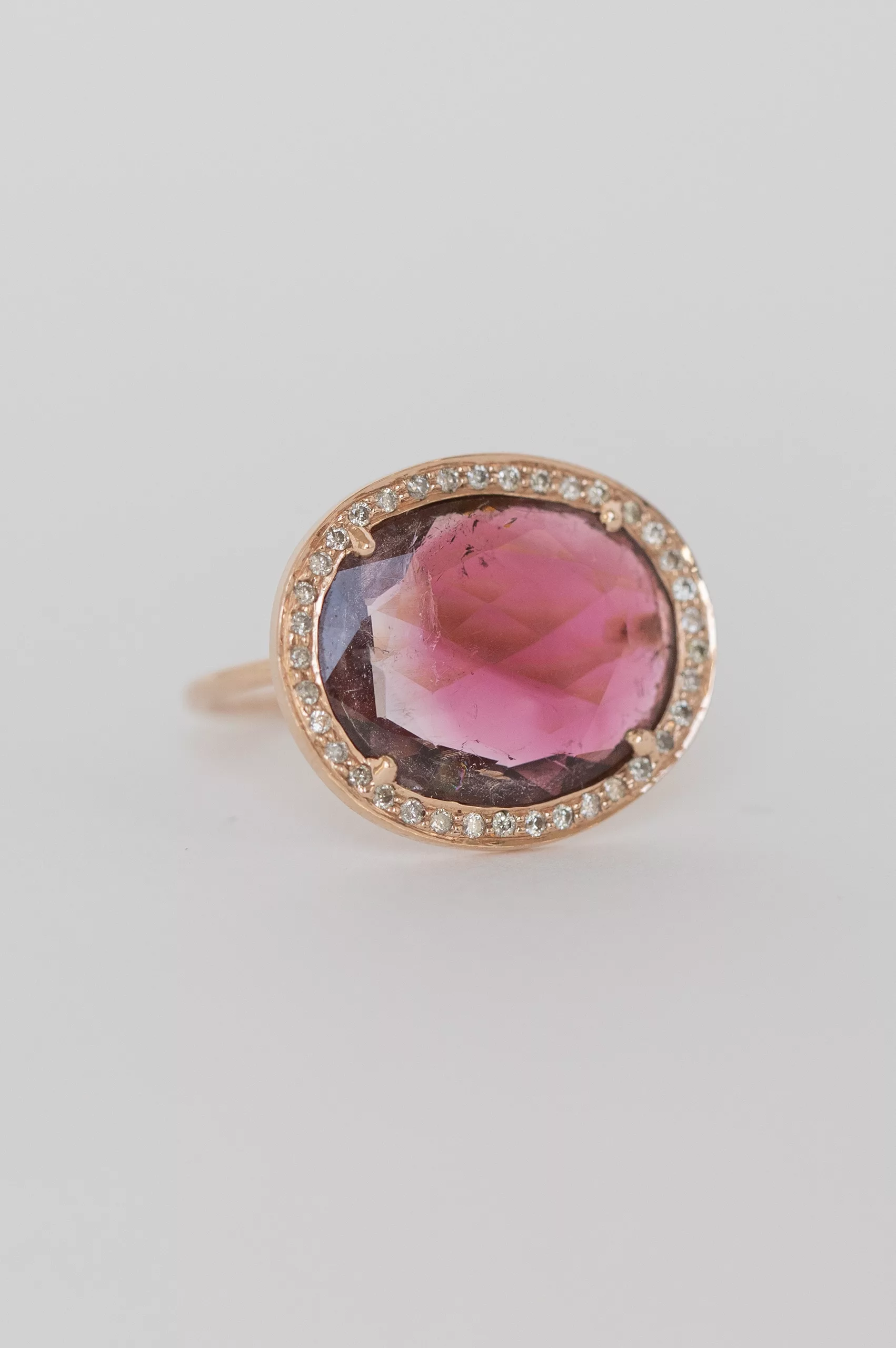 Rose gold ring oval pink tourmaline pavé diamond halo worn on hand Celine Daoust