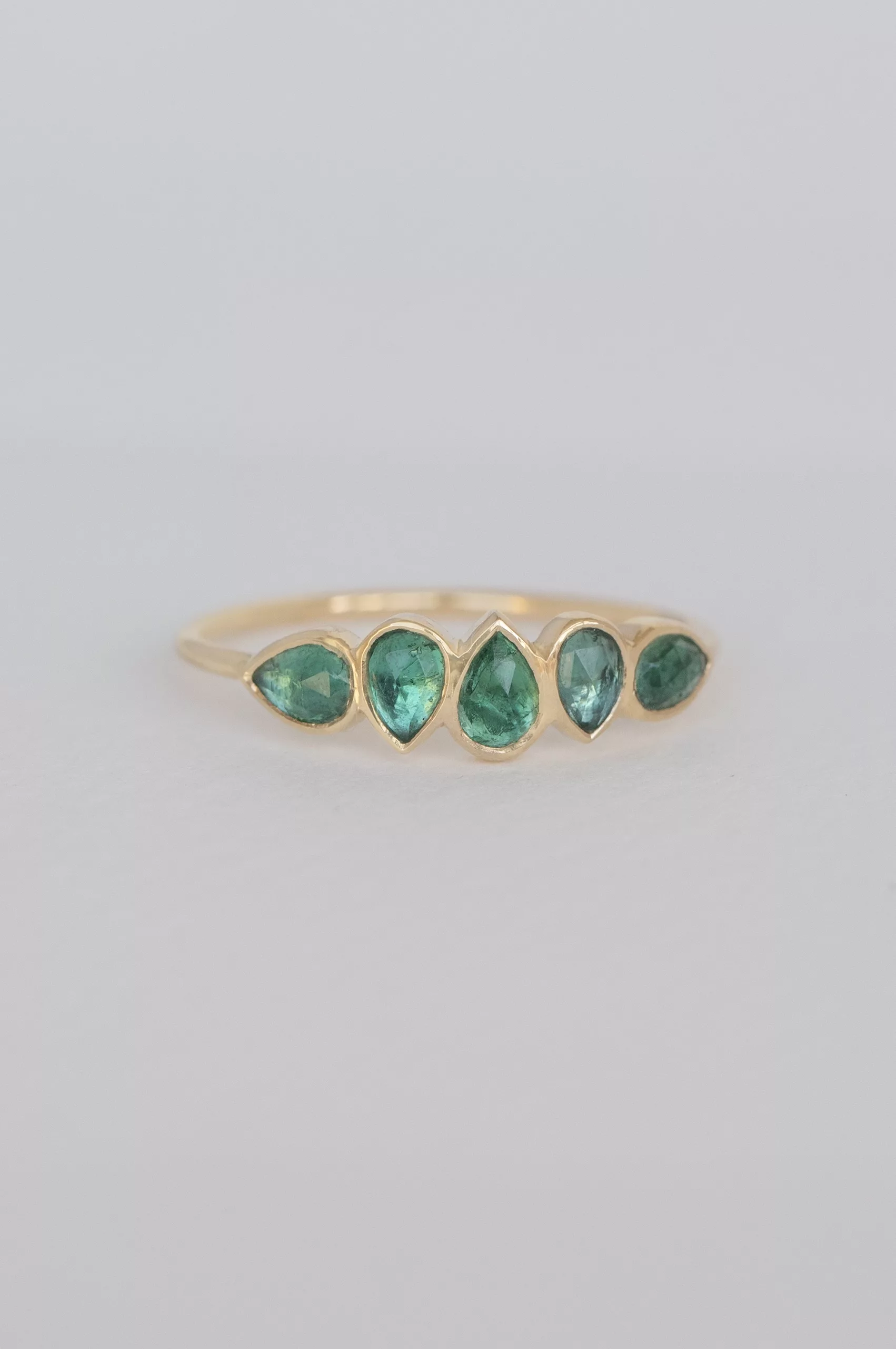 Yellow gold multi pear shaped green emeralds ring Celine Daoust