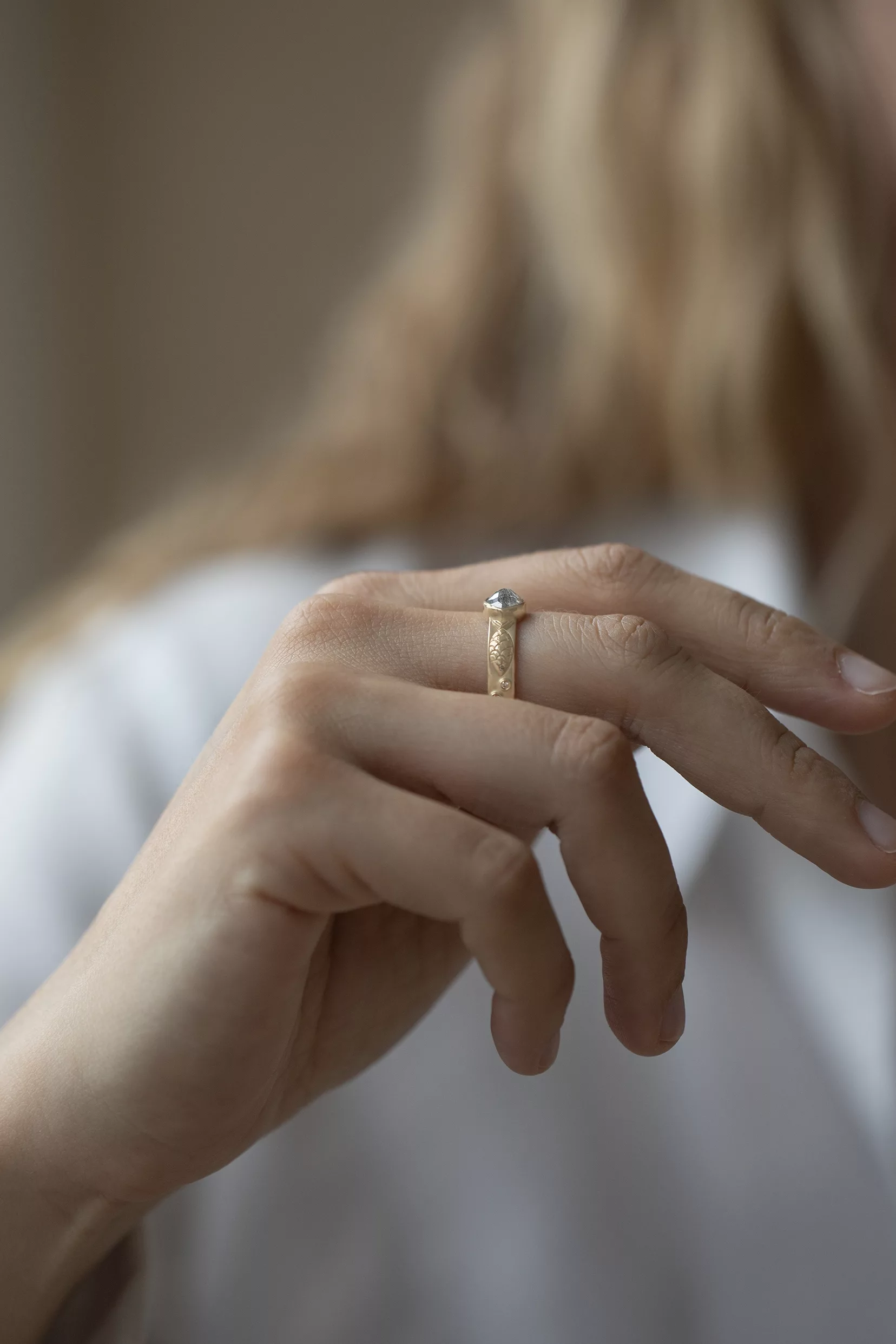 Yellow gold engraved band ring oval grey diamond fish motif Celine Daoust